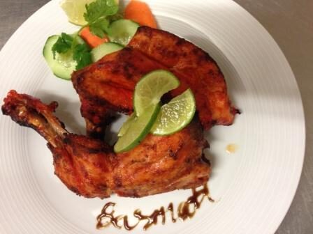 Tandoori chicken on a white plate